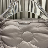 Close-up detail shot of Louis Vuitton luxury clothing with logo-detail design