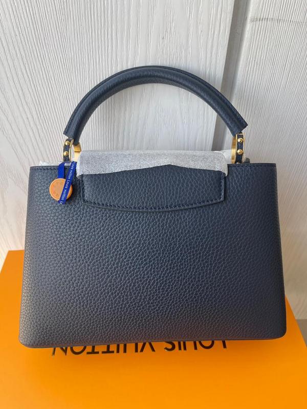 Handle and strap detail of premium refined women's handbag – women's luxury handbag