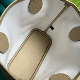 Side profile of polished premium women's handbag – women's statement bag