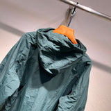 Close-up detail shot of Louis Vuitton luxury clothing with label-forward styling