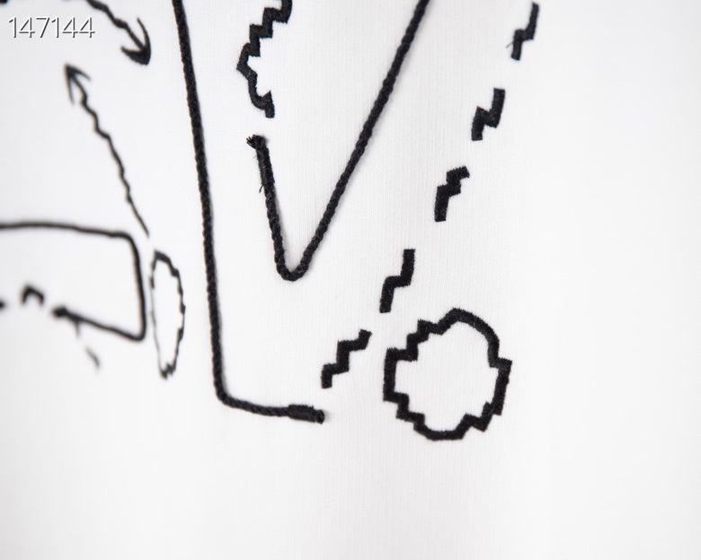 Close-up detail shot of Louis Vuitton luxury clothing with tailored silhouette