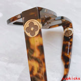 Lifestyle view of Louis Vuitton unisex sunglasses