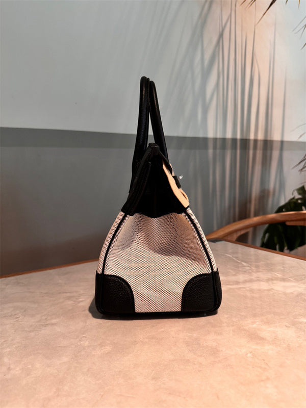 Side view of refined structured handbag