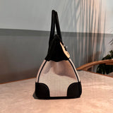 Side view of refined structured handbag