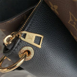  clean-lined top-handle bag styled with outfit