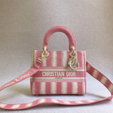 Front view of polished classic women's handbag – women's luxury accessory