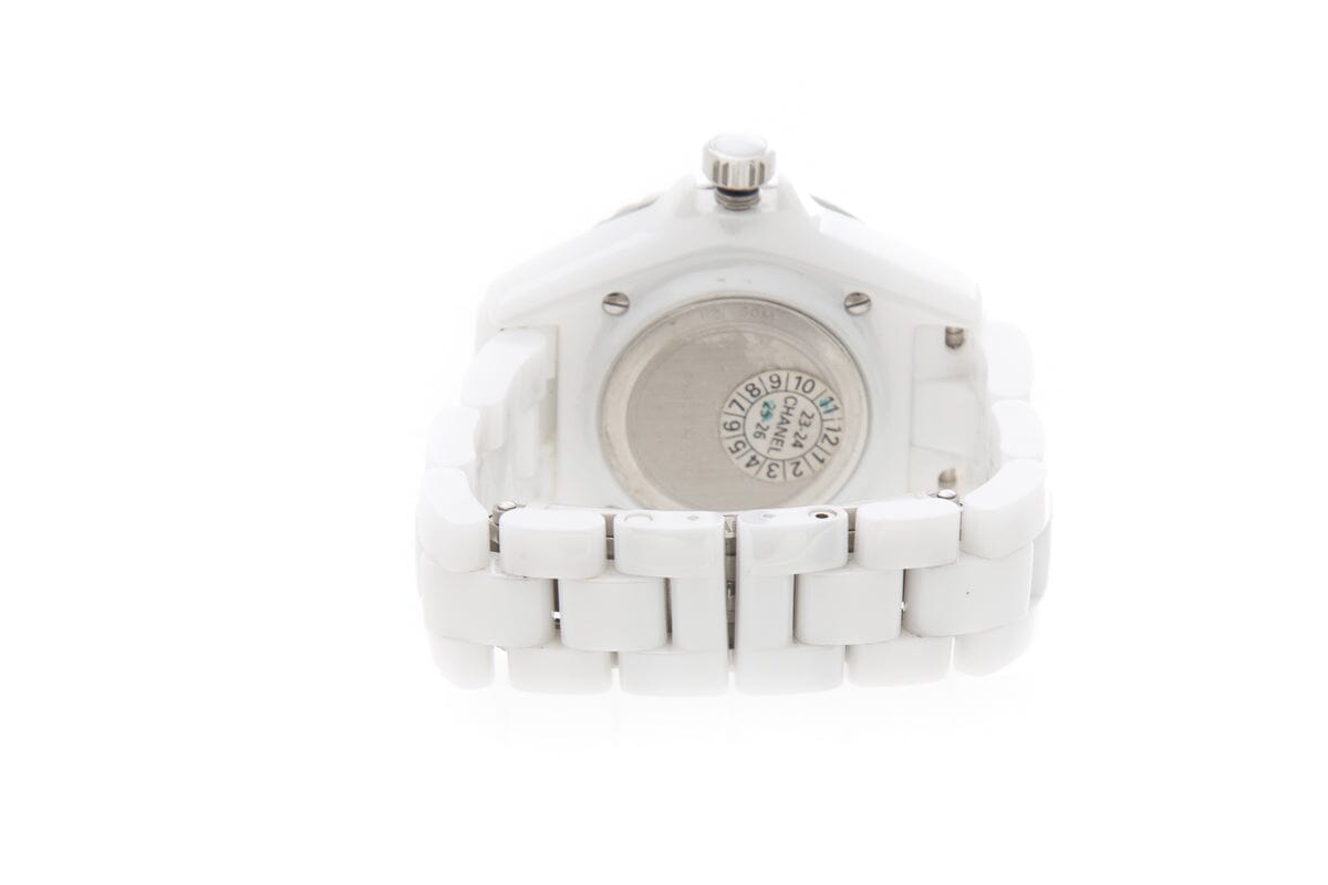 Close-up detail view of Chanel unisex white watch