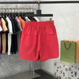 Side profile of Rhude luxury clothing with logo-detail design