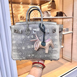 Side view of understated structured handbag