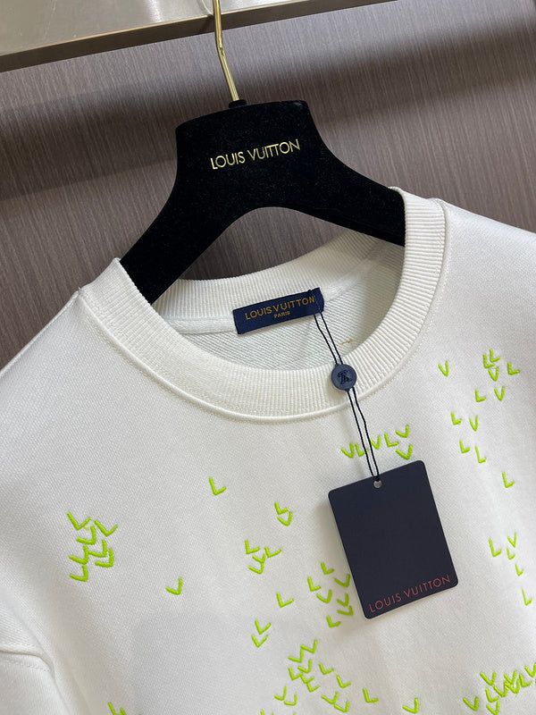 Front view of Louis Vuitton luxury clothing with tailored silhouette