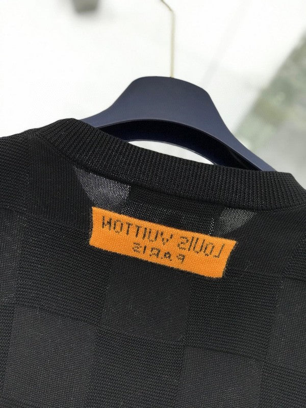 Back view of Louis Vuitton luxury clothing with signature branding
