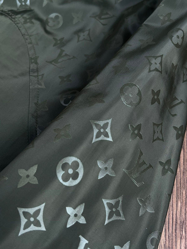 Flat lay presentation of Louis Vuitton luxury clothing with logo-detail design