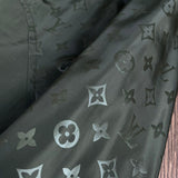 Flat lay presentation of Louis Vuitton luxury clothing with logo-detail design