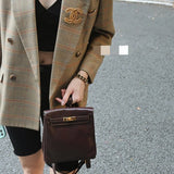 Side view of polished structured handbag