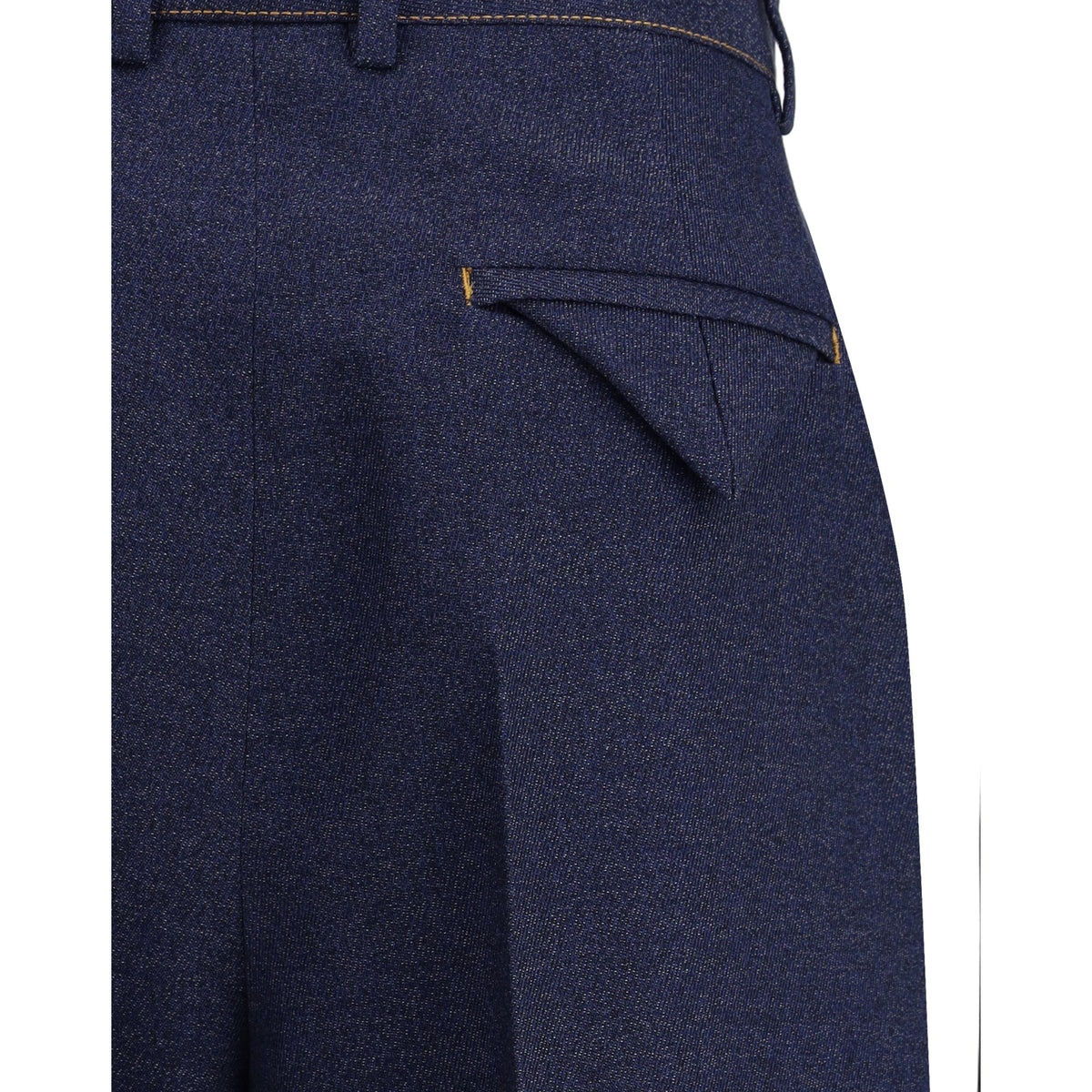 Close-up of Bottega Veneta pants hardware and fine stitching