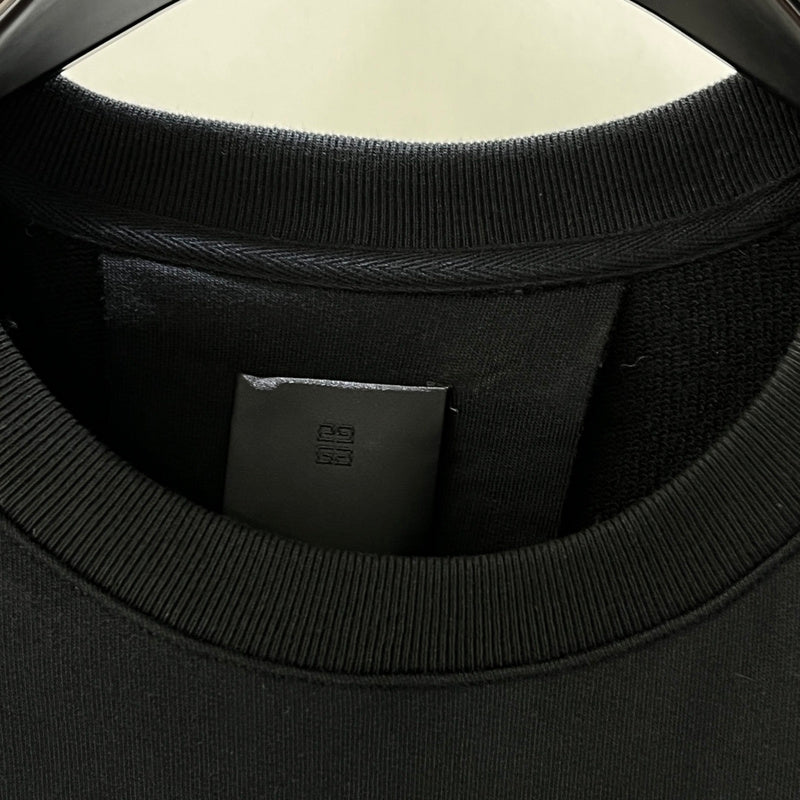 Close-up detail shot of Givenchy luxury clothing with contemporary cut