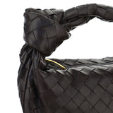 Close-up of Bottega Veneta shoulder bags hardware and fine stitching