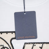 Flat lay presentation of Louis Vuitton luxury clothing with label-forward styling