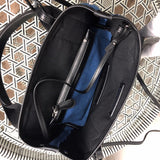 Side profile of premium structured women's handbag – women's statement bag