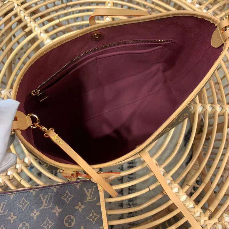 Side profile of statement classic women's handbag – women's luxury accessory
