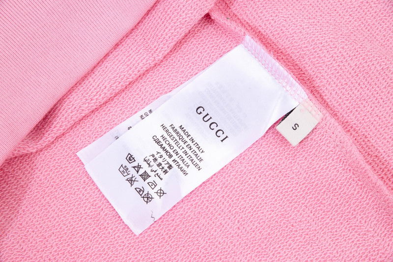 Close-up detail shot of Gucci luxury clothing with relaxed-fit cut