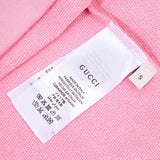 Close-up detail shot of Gucci luxury clothing with relaxed-fit cut