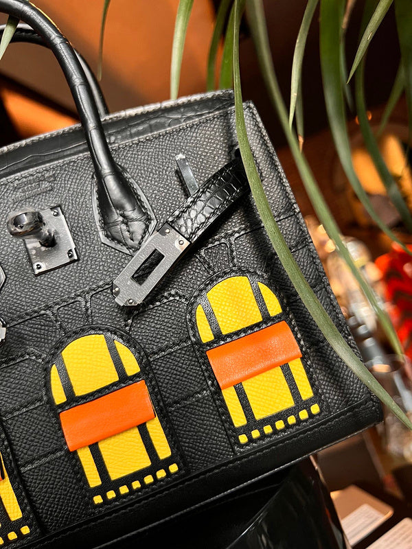 Side view of understated structured handbag