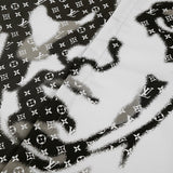 Close-up detail shot of Louis Vuitton luxury clothing with logo-detail design
