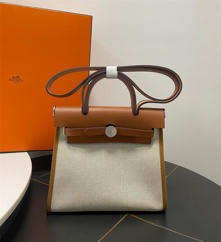  Polished handbag carried on shoulder 28