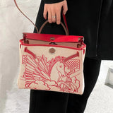 Side view of sophisticated structured handbag