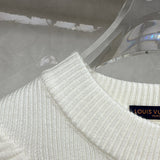 Close-up detail shot of Louis Vuitton luxury clothing with relaxed-fit cut