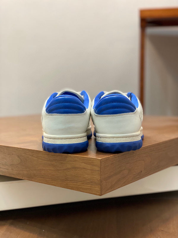 Side profile of Gucci two-tone sneakers signature lace-up style