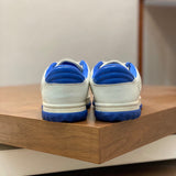 Side profile of Gucci two-tone sneakers signature lace-up style