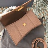 Front view of polished elevated women's handbag – women's luxury accessory