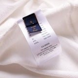 Close-up detail shot of Louis Vuitton luxury clothing with label-forward styling