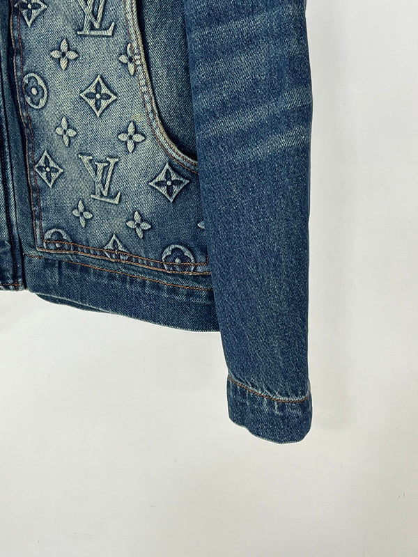 Flat lay presentation of Louis Vuitton luxury clothing with runway-inspired design