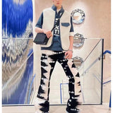 Side profile of Louis Vuitton luxury clothing with label-forward styling