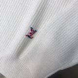 Close-up detail shot of Louis Vuitton luxury clothing with monogram-inspired silhouette