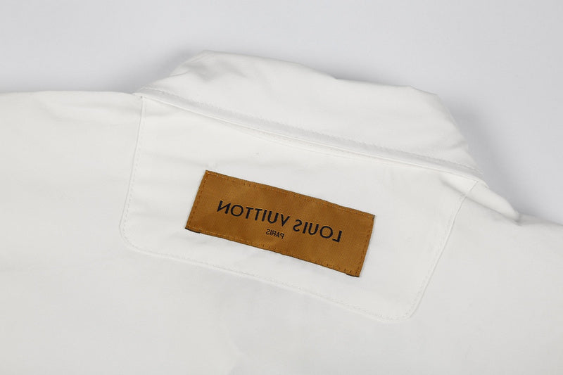 Close-up detail shot of Louis Vuitton luxury clothing with monogram-inspired silhouette