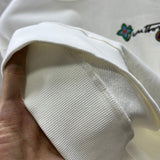 Back view of Louis Vuitton luxury clothing with logo-detail design