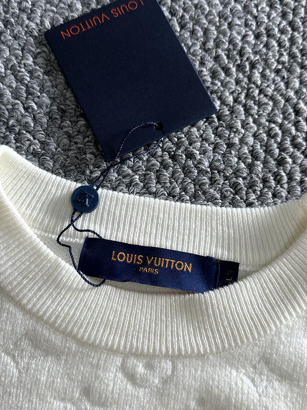 Front view of Louis Vuitton luxury clothing with logo-detail design