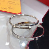 Front view of Cartier unisex jewelry piece