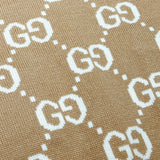 Close-up detail shot of Gucci luxury clothing with monogram-inspired silhouette