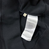 Front view of Gucci luxury clothing with signature branding