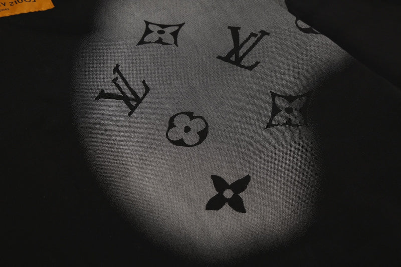 Close-up detail shot of Louis Vuitton luxury clothing with monogram-inspired silhouette