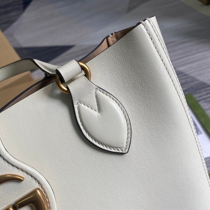 Styled lifestyle shot of everyday-luxe structured women's handbag – women's luxury handbag