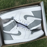 Side profile of Nike two-tone sneakers breathable knit upper
