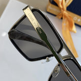 Close-up detail view of Louis Vuitton unisex sunglasses