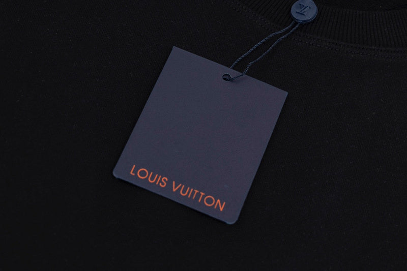 Full styled look of Louis Vuitton luxury clothing with label-forward styling