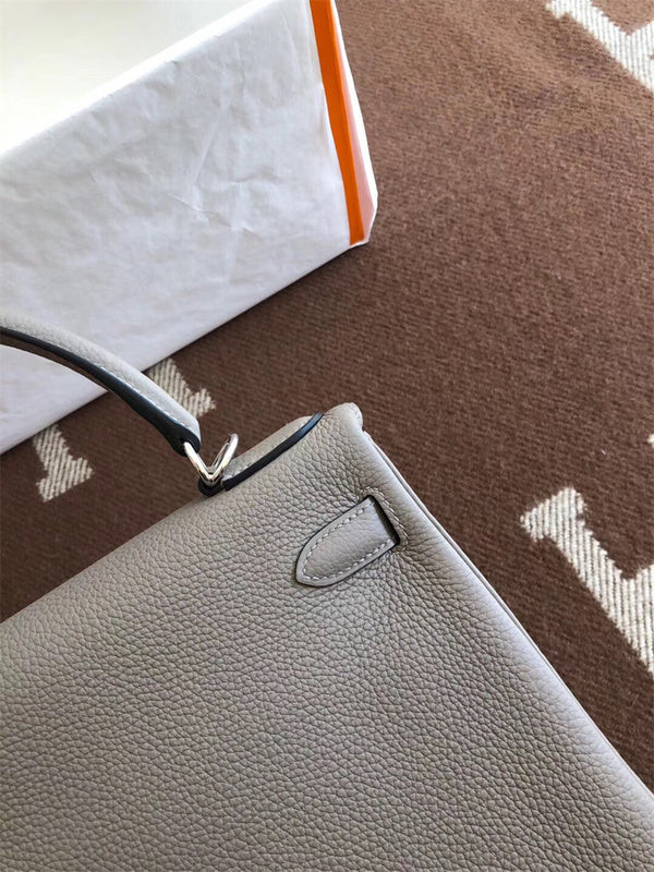 Side view of streamlined structured handbag